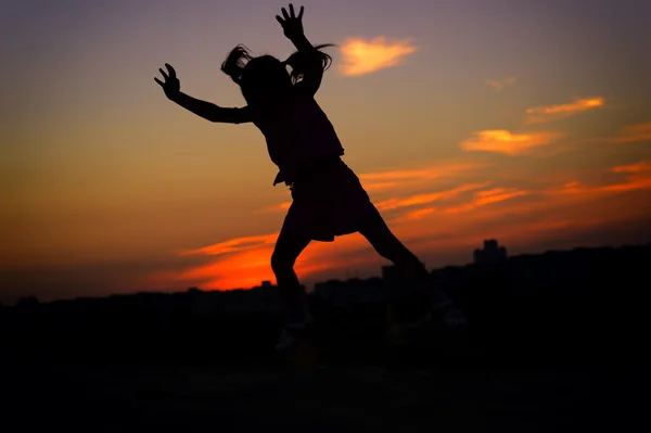 Little girl at sunset — Stock Photo, Image