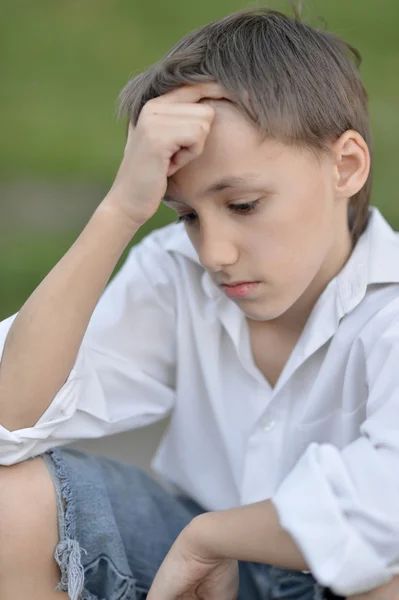 Sad boy in nature — Stock Photo, Image