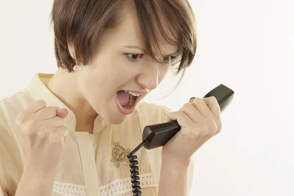Mujer y teléfono en un beige — Foto de Stock