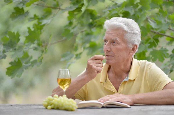 Senior man at table — Stock Photo, Image