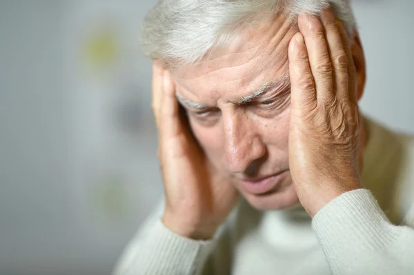 Elderly man has a had pain — Stock Photo, Image