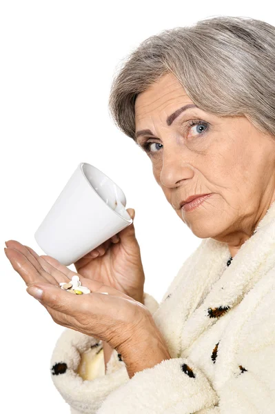 Elderly woman taking pills — Stock Photo, Image