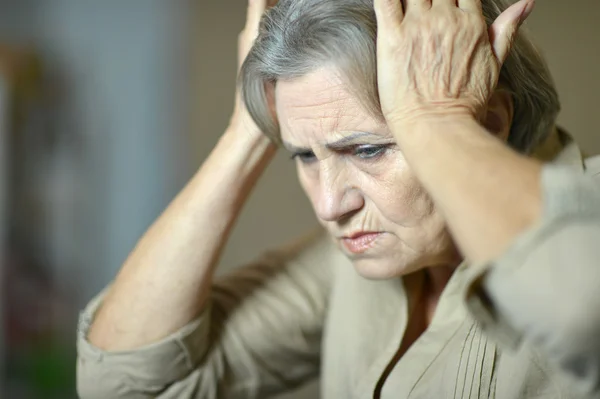 Woman with a headache — Stock Photo, Image