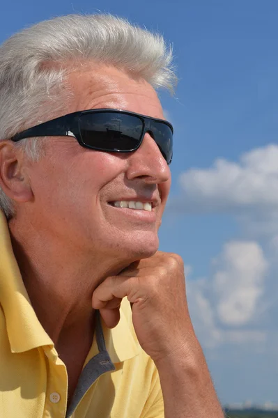 Portrait of a mature man on the background of sky — Stock Photo, Image