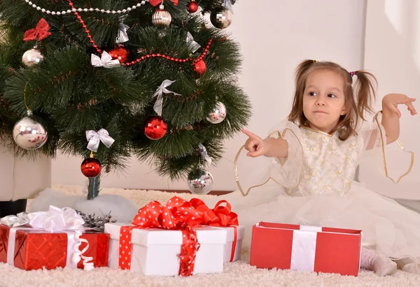 Little girl with Christmas gifts — Stock Photo, Image