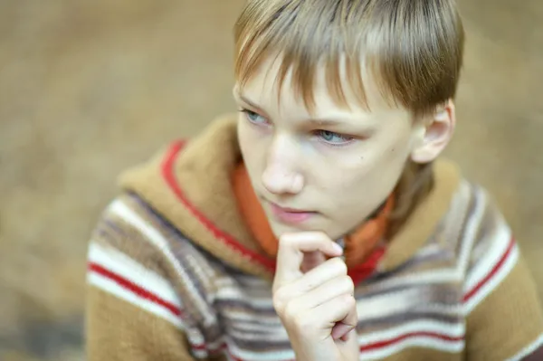 Sad boy in nature — Stock Photo, Image