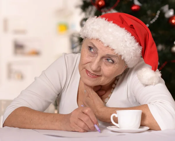 Elderly woman with gift — Stock Photo, Image