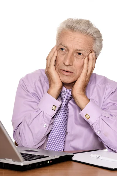 Elderly businessman with laptop — Stock Photo, Image
