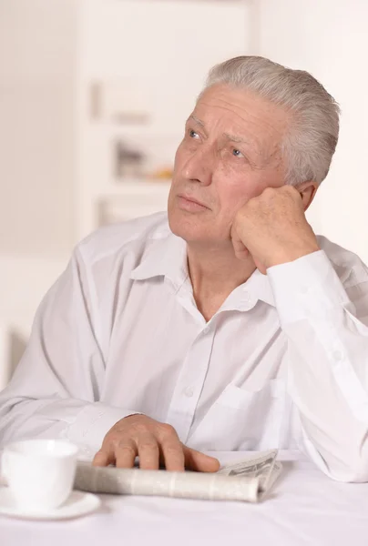 Senior man with newspaper — Stock Photo, Image