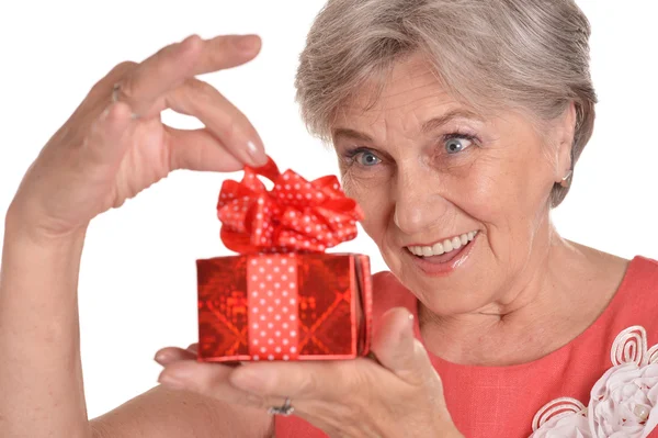 Happy elderly woman with gift — Stock Photo, Image