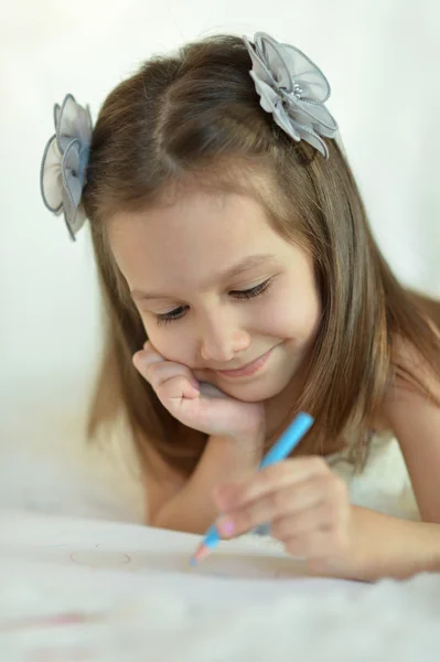 Girl with blue pencil — Stock Photo, Image