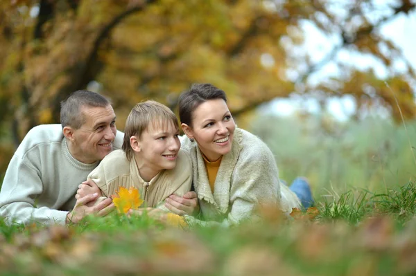 Happy family in the autumn park — Stock Photo, Image