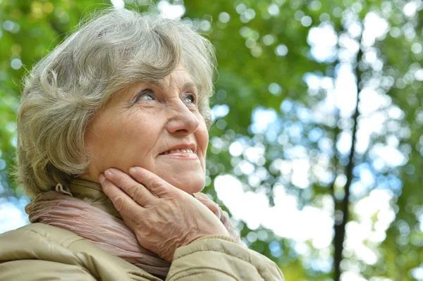 Beautiful elderly woman at nature — Stock Photo, Image