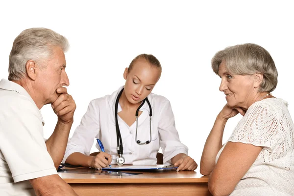 Elderly patients couple came to visit a young doctor — Stock Photo, Image
