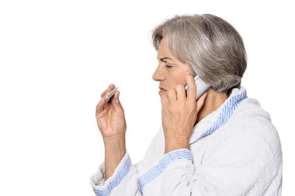 Sick elderly woman callin on phone — Stock Photo, Image