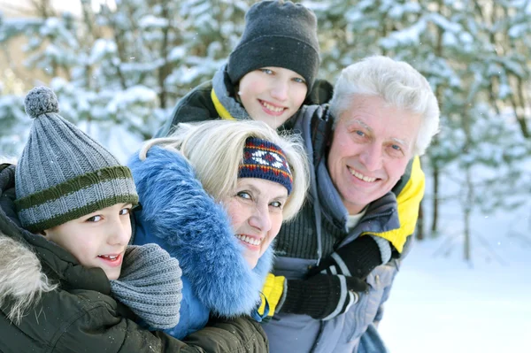 Happy family in winter outdoors — Stock Photo, Image