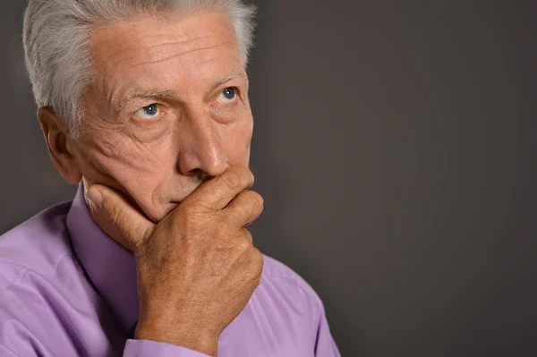 Elderly on a grey background — Stock Photo, Image