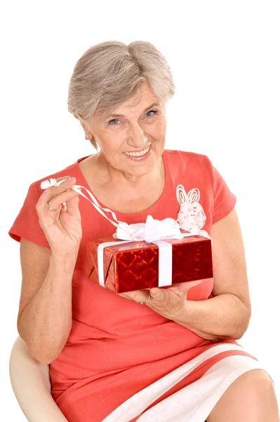 Happy elderly woman with gift — Stock Photo, Image