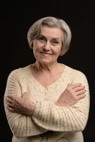 Elderly woman on black background — Stock Photo, Image