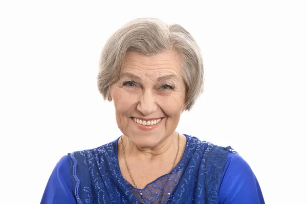 Şık elbiseli yaşlı kadın gülümseyerek mutlu — Stok fotoğraf
