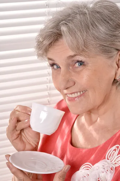 Senior woman with cup — Stock Photo, Image