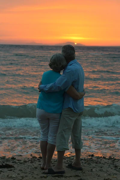Elderly couple  at sunset — Stock Photo, Image