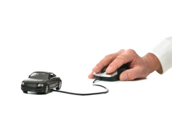 Hand som håller miniatyr bil datormus — Stockfoto