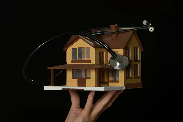 Woman hands  holding miniature house — Stock Photo, Image