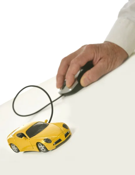 Hand met miniatuur auto computermuis — Stockfoto