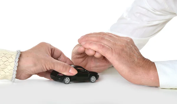 Couple hands with miniature car — Stock Photo, Image