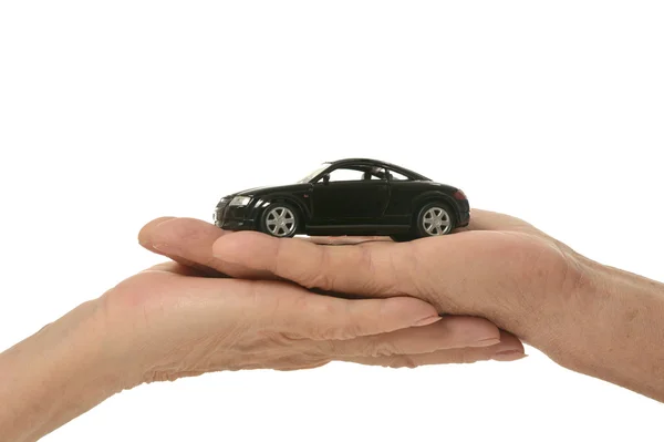 Mãos com carro em miniatura — Fotografia de Stock