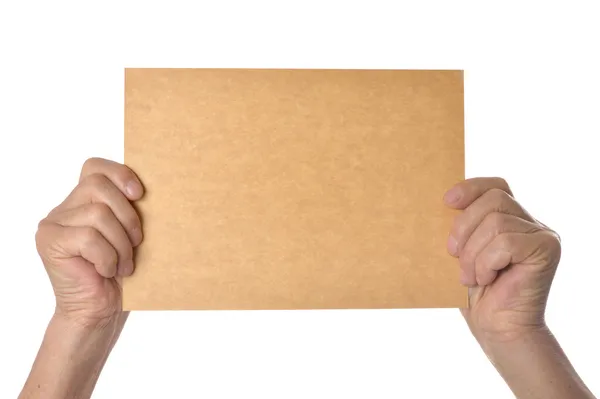 Ruka držící prázdný papír — Stock fotografie