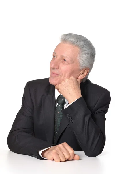 Thoughtful elderly man in suit — Stock Photo, Image