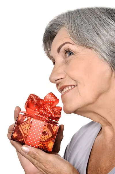 Elderly woman with gift — Stock Photo, Image