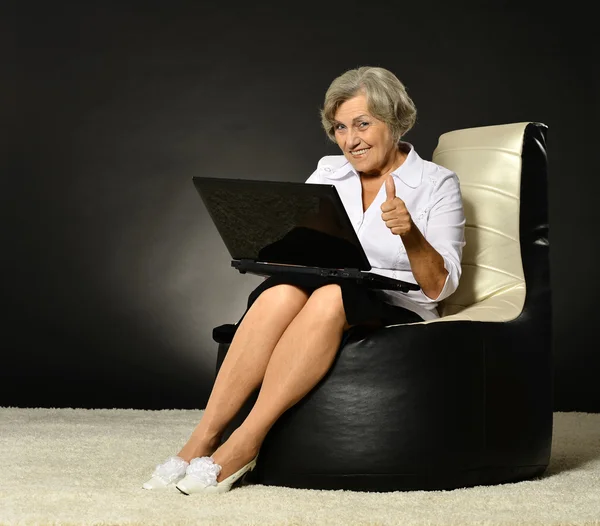 Happy beautiful senior woman with laptop — Stock Photo, Image