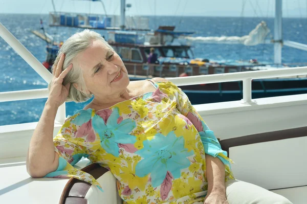 Senior woman having boat ride — Stock Photo, Image