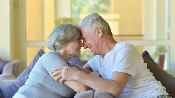 Charming old couple in hotel — Stock Photo, Image