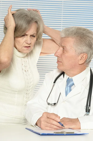Elderly woman came to the doctor Stock Image