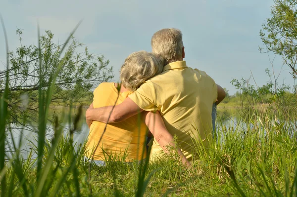 Elderly couple in nature — Stock Photo, Image