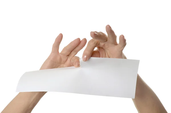 Hände reißen Papierbogen — Stockfoto