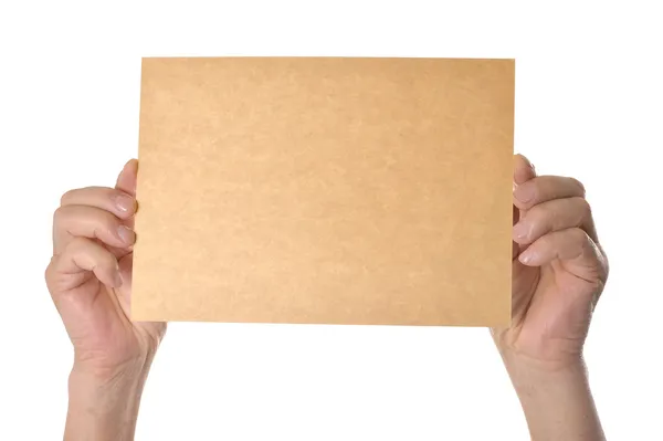 Ręce trzymając papier blank — Zdjęcie stockowe