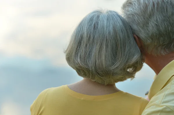 Senior couple on  sky background — Stock Photo, Image