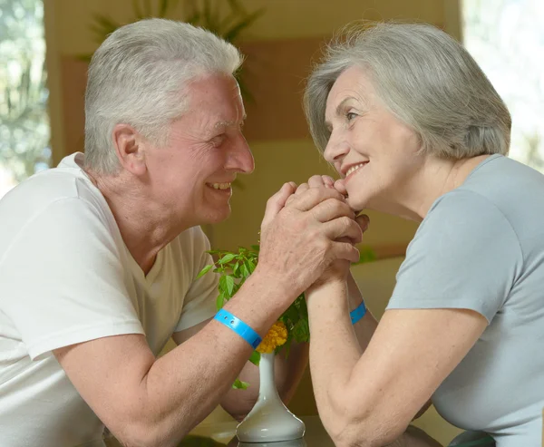 Old couple in hotel — Stock Photo, Image