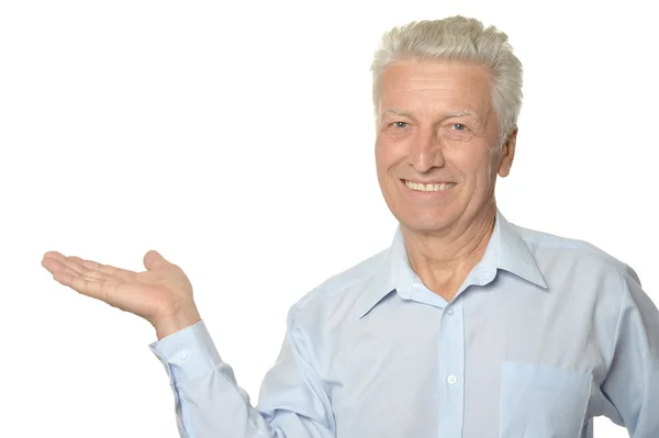 Senior man showing something — Stock Photo, Image