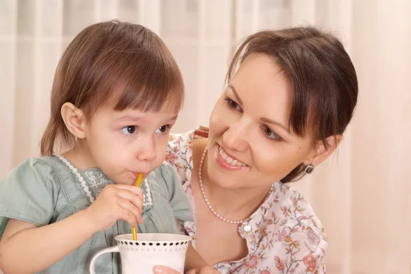 Cute little girl drinking — Stock Photo, Image