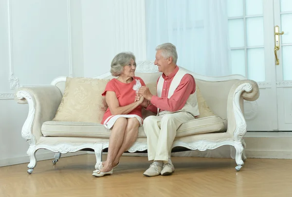 Elderly couple on wooden porch — Stock Photo, Image