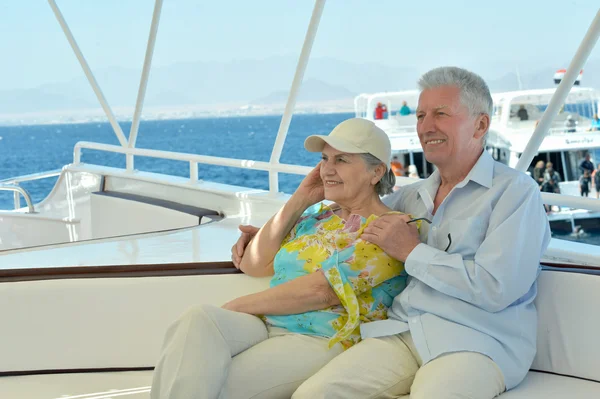 Elderly couple have a ride in a boat — Stock Photo, Image