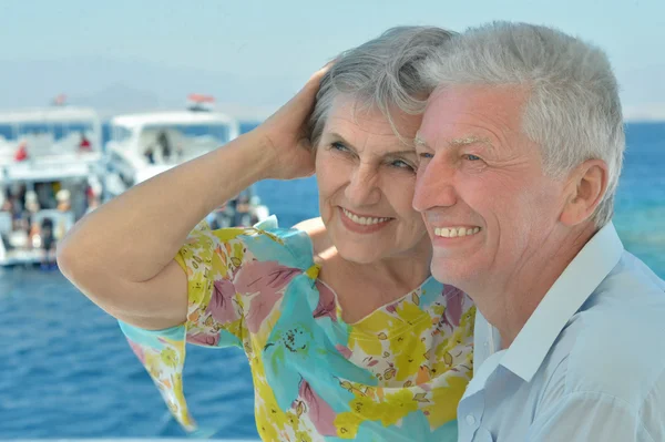 Elderly couple have a ride in a boat — Stock Photo, Image