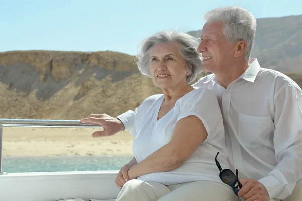 Elderly couple have a ride in a boat — Stock Photo, Image