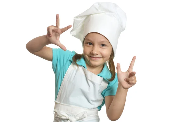 Chica en uniforme de chef mostrando los dedos — Foto de Stock